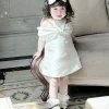 váy chữ A đính nơ cho bé